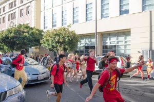BHS students run down Allston Way in Downtown Berkeley during the 2019 Rally Day.