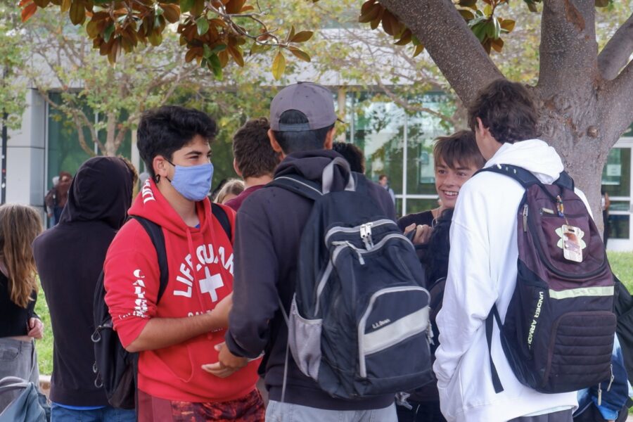 A group of students gathering near the main courtyard at BHS
