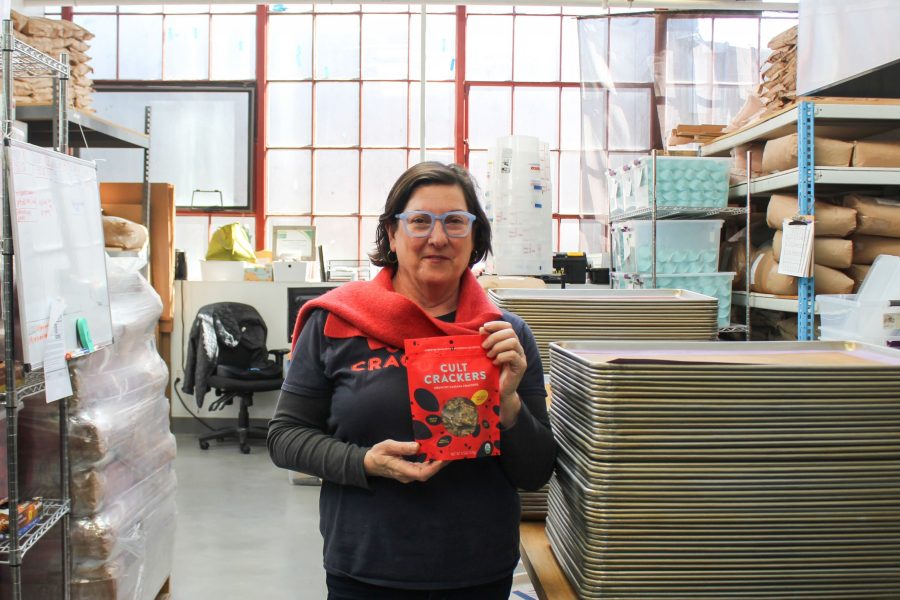 Diana Dar holds up some crackers in her facility.